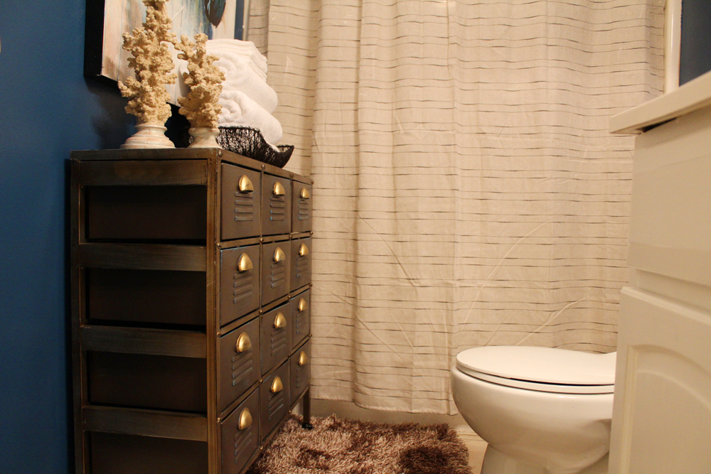 eclectic, blue guest bathroom