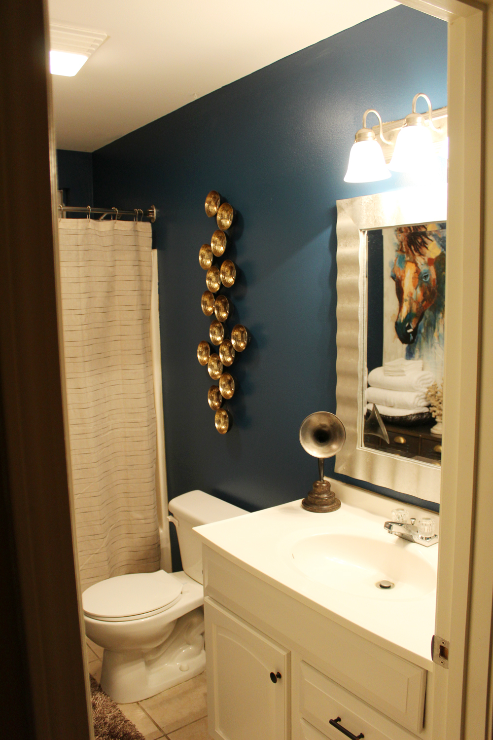 eclectic, blue guest bathroom
