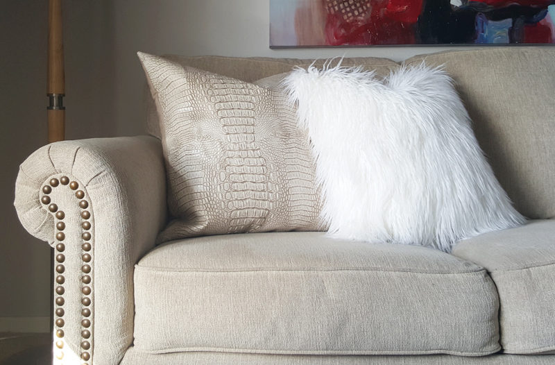 faux leather pillow and white faux fur pillow via whitneyjdecor.com