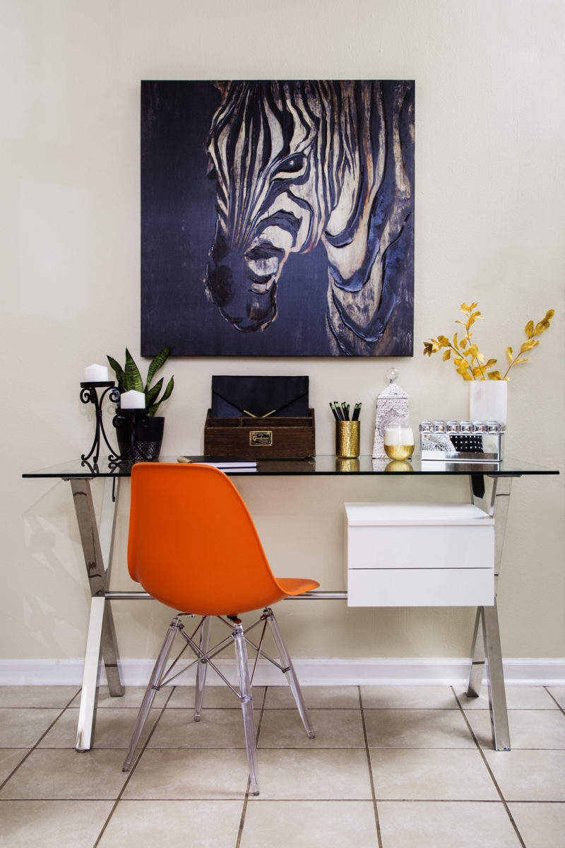 neutral living room | zebra art | home office | home office in living room | desk in living room | chrome desk | glass desk | orange desk chair | britt smith photography