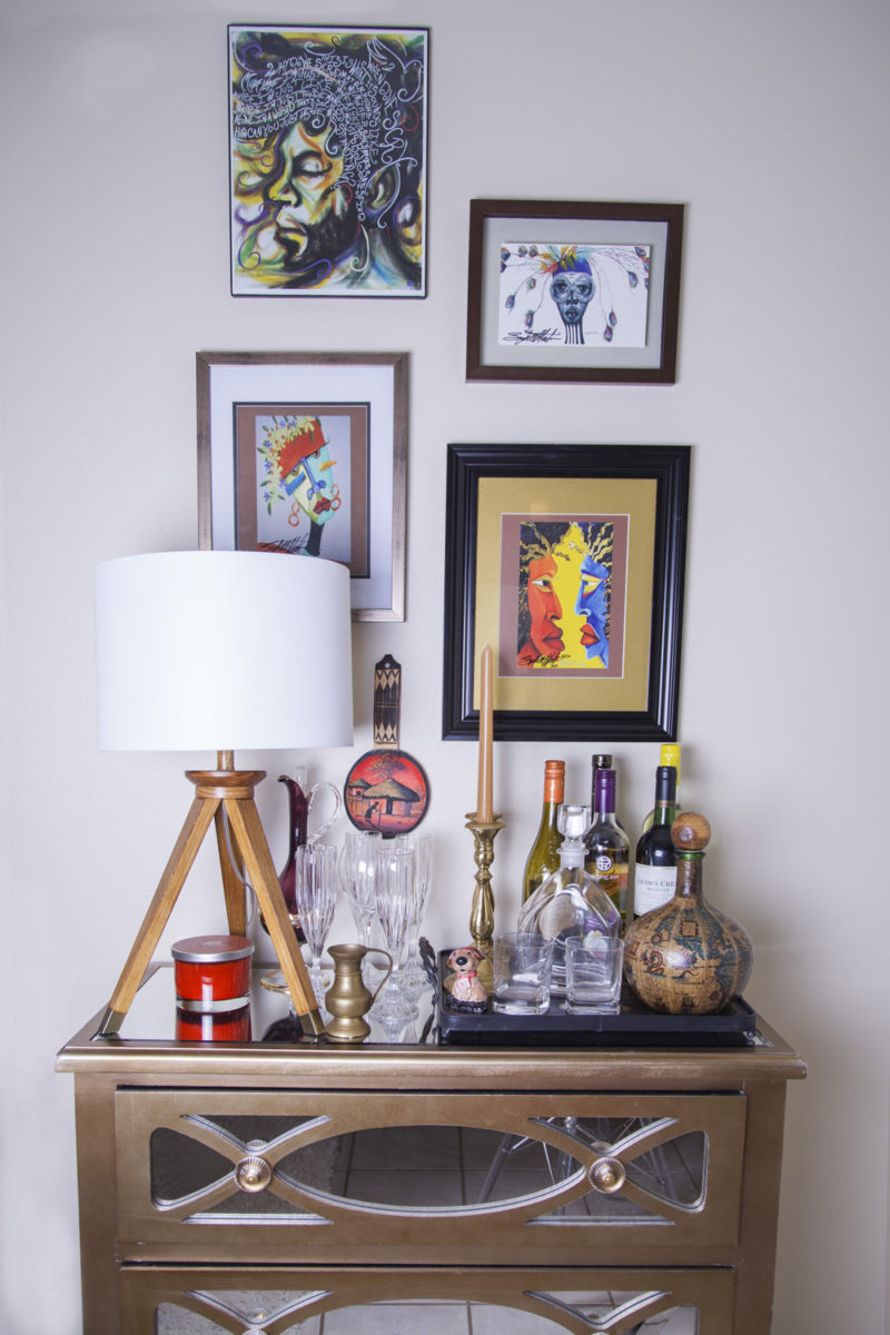 neutral living room | bar cart | dresser used as bar cart | eclectic bar cart | colorful art over bar cart | britt smith photography