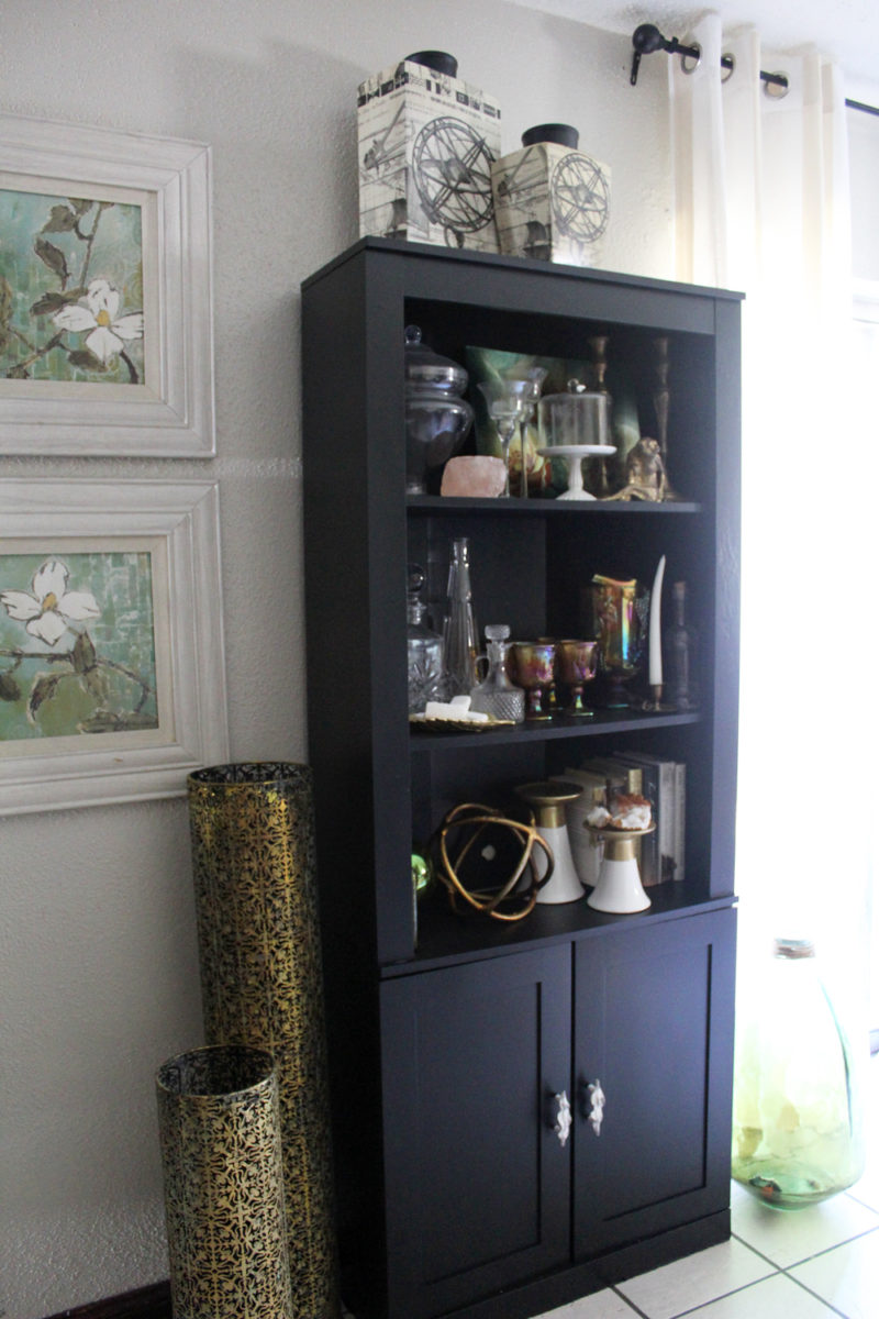 painted black bookcase with doors | bookase in living room | bookcase styling