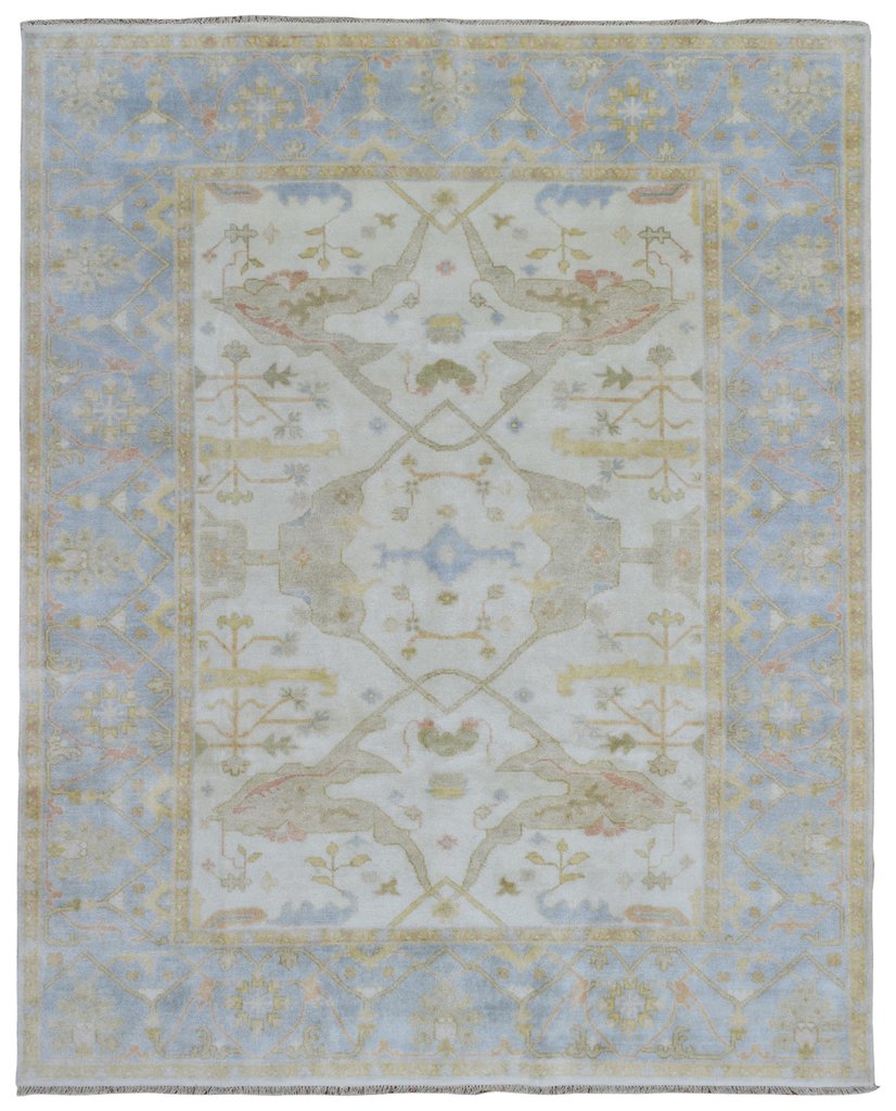 traditional room | transitional living room with traditional rug | glam living room | neutral transitional living room | blue neutral living room | soft blue living room | oushak oriental rug