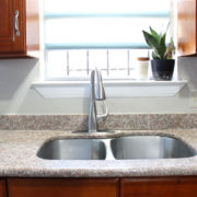 roller shades in a kitchen with blinds.com | custom window treatments | custom roller shades