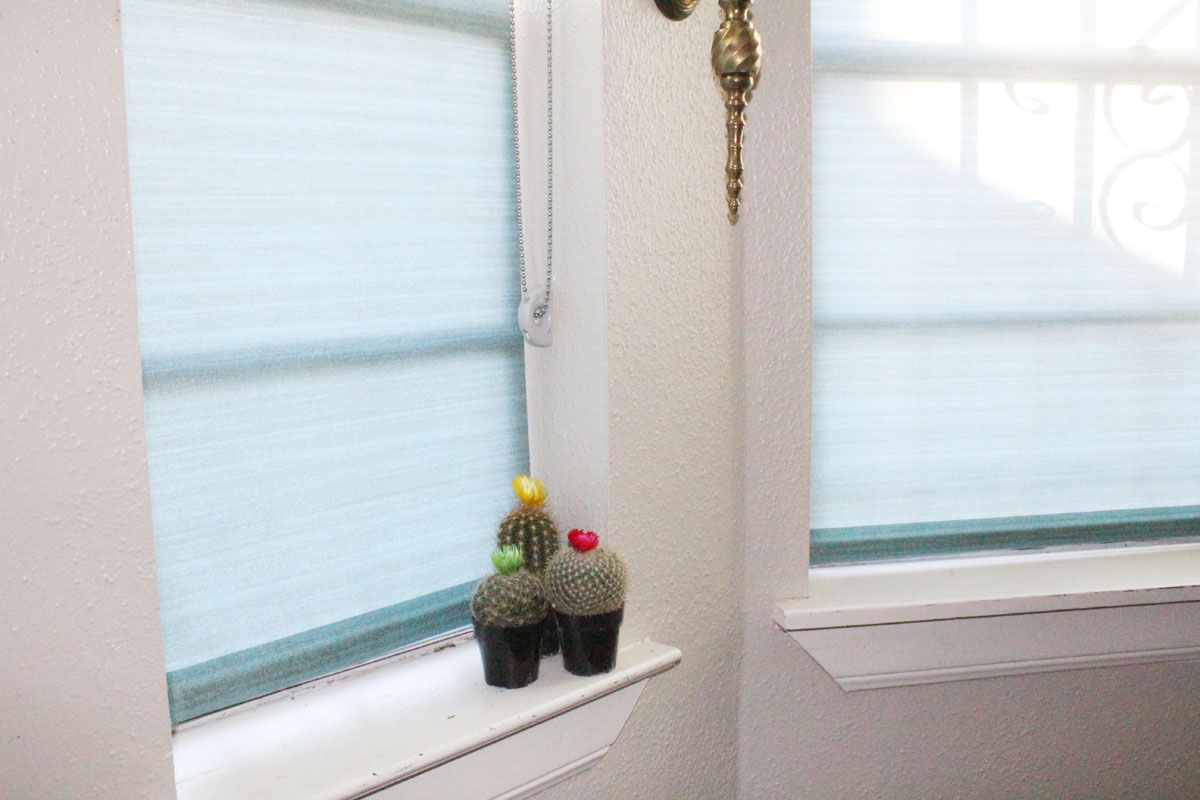 roller shades in a kitchen with blinds.com | custom window treatments | custom roller shades