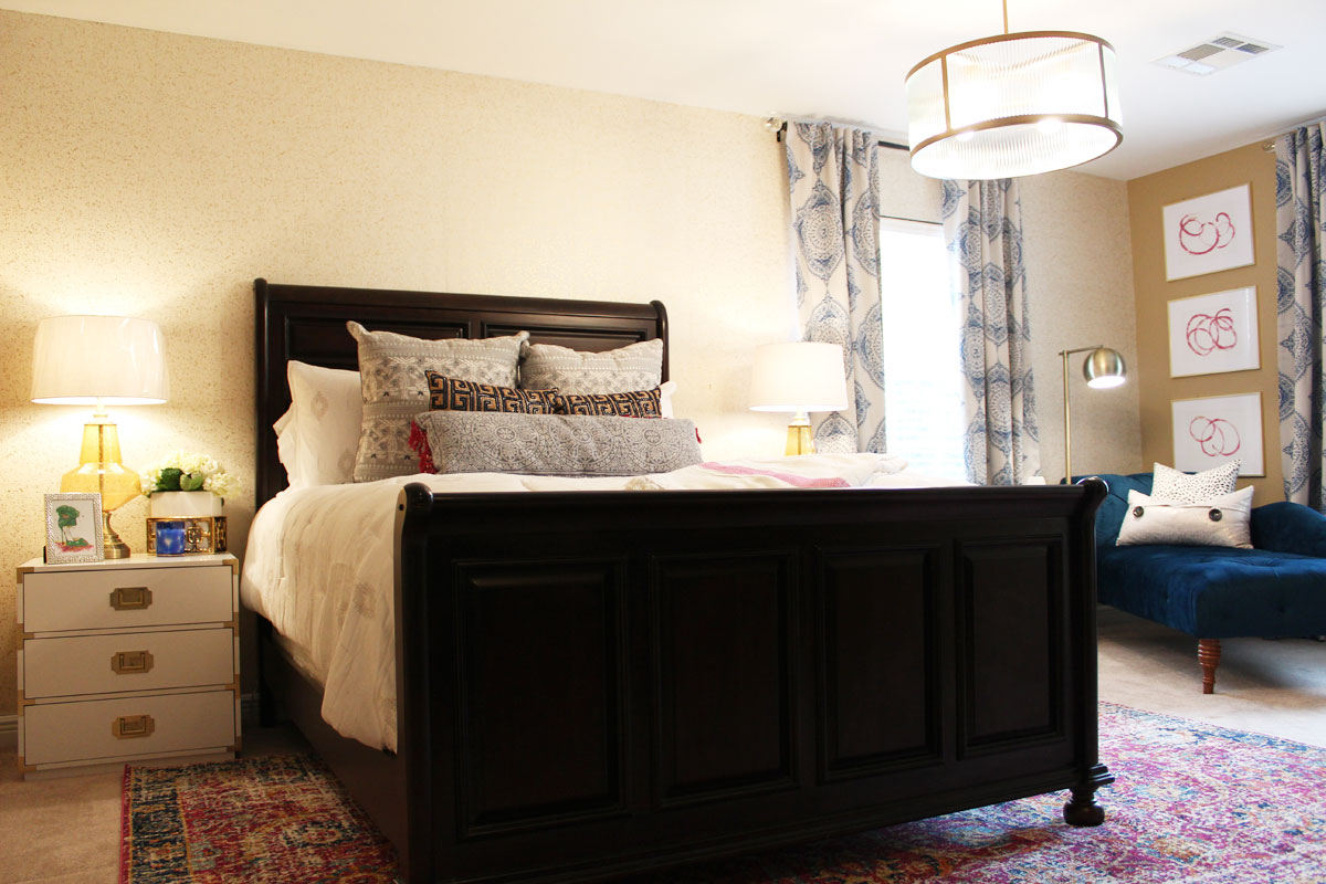 pink and blue transitional bedroom | blue bedroom | pink bedroom | transitional bedroom | glam bedroom | pink diy art | how to transform a master bedroom | white campaign dresser | blue chaise | nate berkus bedding