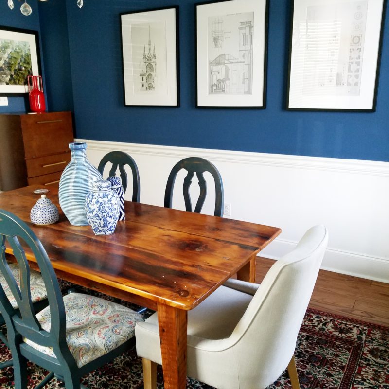 whitney j decor | transitional dining room | blue dining room walls | dark blue walls | sherwin williams endless sea paint | vintage red rug and blue walls in dining room
