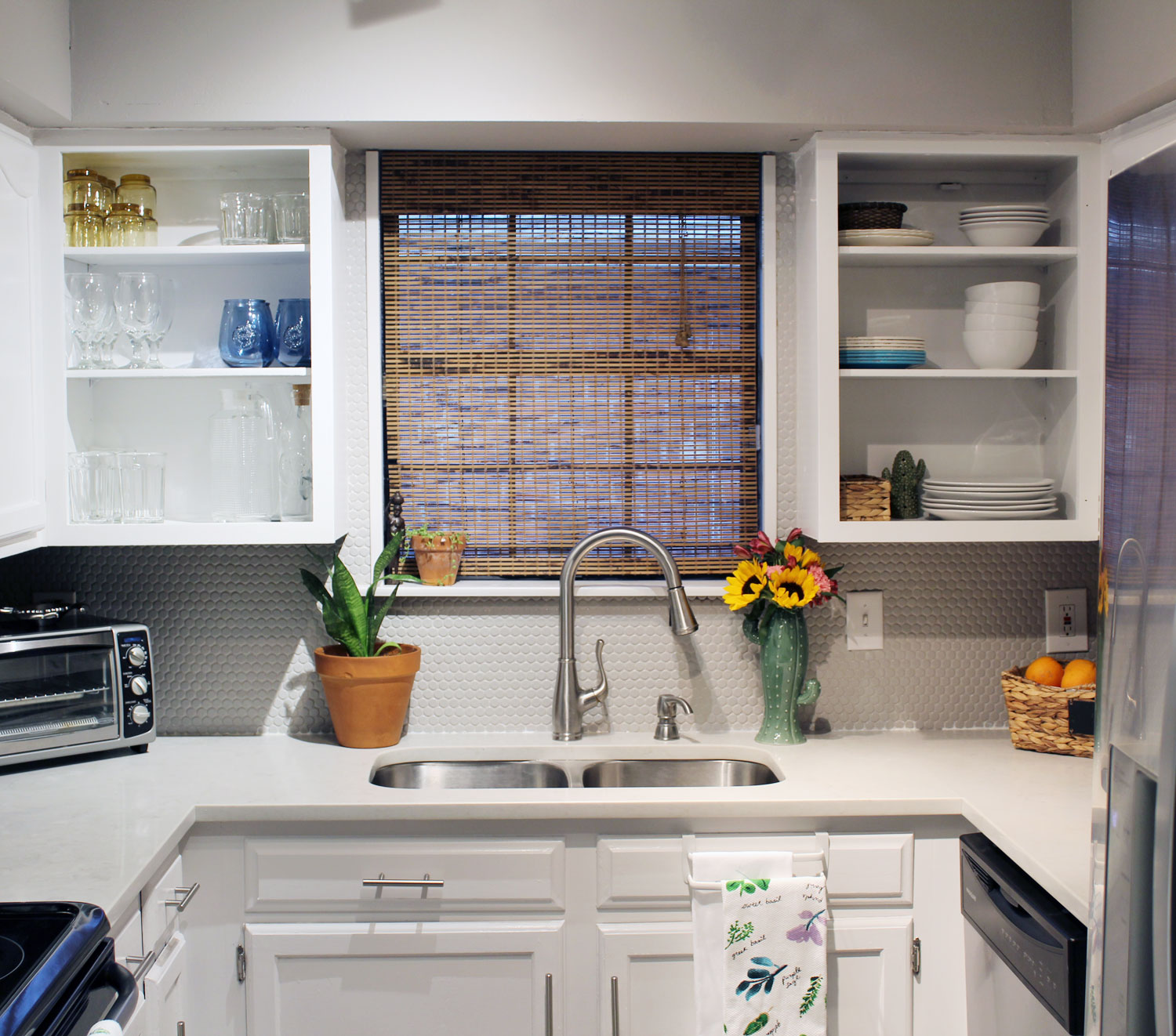 caesarstone london grey countertops | caesarstone countertops | gray and white kitchen reveal whitney j decor | caesarstone countertops | gray and white kitchen | small gray kitchen | small galley kitchen | small white kitchen | small space kitchens | tiny kitchen decor | gray and white kitchen decor | white kitchen decor | new orleans interior design | new orleans decor | new orleans homes | nola homes | nola decorator | new orleans decorator