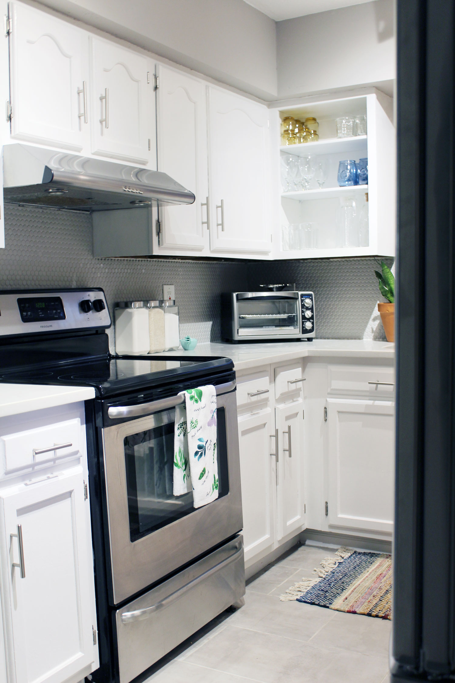 caesarstone london grey countertops | caesarstone countertops | gray and white kitchen reveal whitney j decor | caesarstone countertops | gray and white kitchen | small gray kitchen | small galley kitchen | small white kitchen | small space kitchens | tiny kitchen decor | gray and white kitchen decor | white kitchen decor | new orleans interior design | new orleans decor | new orleans homes | nola homes | nola decorator | new orleans decorator