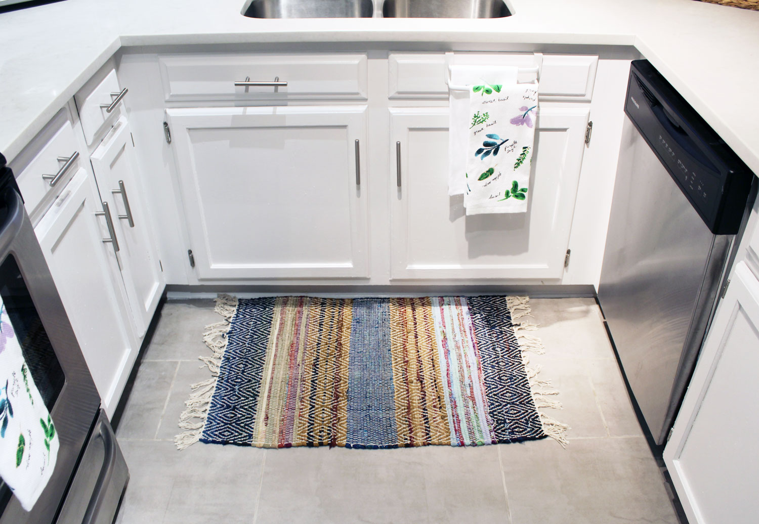 caesarstone london grey countertops | caesarstone countertops | gray and white kitchen reveal whitney j decor | caesarstone countertops | gray and white kitchen | small gray kitchen | small galley kitchen | small white kitchen | small space kitchens | tiny kitchen decor | gray and white kitchen decor | white kitchen decor | new orleans interior design | new orleans decor | new orleans homes | nola homes | nola decorator | new orleans decorator