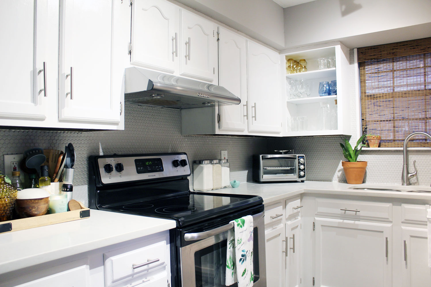caesarstone london grey countertops | caesarstone countertops | gray and white kitchen reveal whitney j decor | caesarstone countertops | gray and white kitchen | small gray kitchen | small galley kitchen | small white kitchen | small space kitchens | tiny kitchen decor | gray and white kitchen decor | white kitchen decor | new orleans interior design | new orleans decor | new orleans homes | nola homes | nola decorator | new orleans decorator