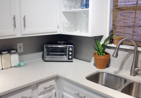 caesarstone london grey countertops | caesarstone countertops | gray and white kitchen reveal whitney j decor | caesarstone countertops | gray and white kitchen | small gray kitchen | small galley kitchen | small white kitchen | small space kitchens | tiny kitchen decor | gray and white kitchen decor | white kitchen decor | new orleans interior design | new orleans decor | new orleans homes | nola homes | nola decorator | new orleans decorator