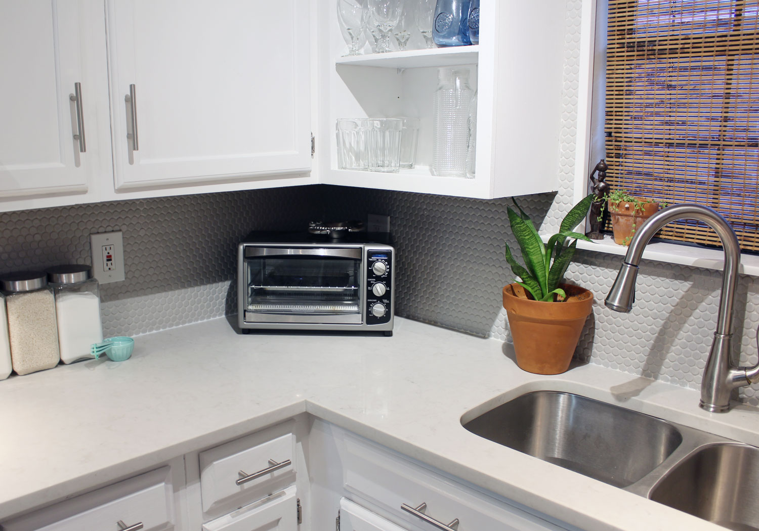 caesarstone london grey countertops | caesarstone countertops | gray and white kitchen reveal whitney j decor | caesarstone countertops | gray and white kitchen | small gray kitchen | small galley kitchen | small white kitchen | small space kitchens | tiny kitchen decor | gray and white kitchen decor | white kitchen decor | new orleans interior design | new orleans decor | new orleans homes | nola homes | nola decorator | new orleans decorator