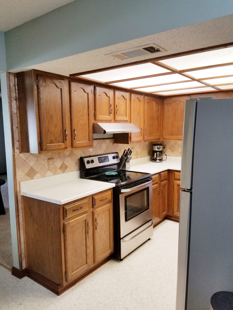 ugly small brown kitchen remodel transformation | caesarstone london grey countertops | caesarstone countertops | gray and white kitchen reveal whitney j decor | caesarstone countertops | gray and white kitchen | small gray kitchen | small galley kitchen | small white kitchen | small space kitchens | tiny kitchen decor | gray and white kitchen decor | white kitchen decor | new orleans interior design | new orleans decor | new orleans homes | nola homes | nola decorator | new orleans decorator