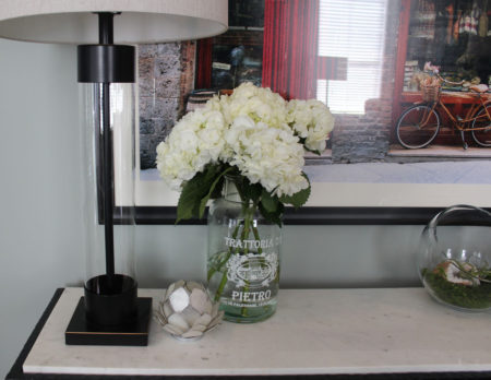 red and blue transitional living room | whitney j decor | new orleans homes | nola decor | red pillows | green walls | sherwin williams oyster gray on the walls | vintage red rug | pottery barn sectional | convertible coffee table | new orleans interior designer | new orleans decorator | new orleans blogger | nola interior designer | nola decorator | nola blogger