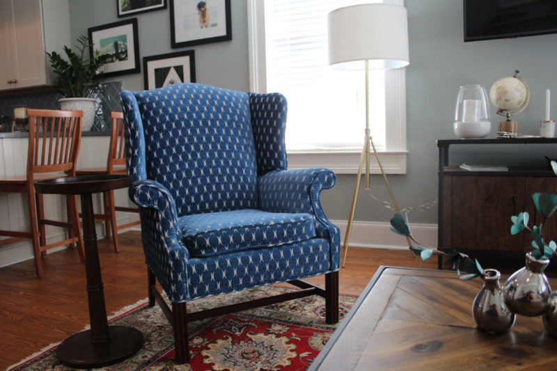 red and blue transitional living room | whitney j decor | new orleans homes | nola decor | red pillows | green walls | sherwin williams oyster gray on the walls | vintage red rug | pottery barn sectional | convertible coffee table | new orleans interior designer | new orleans decorator | new orleans blogger | nola interior designer | nola decorator | nola blogger