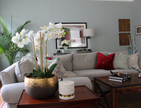 red and blue transitional living room | whitney j decor | new orleans homes | nola decor | red pillows | green walls | sherwin williams oyster gray on the walls | vintage red rug | pottery barn sectional | convertible coffee table | new orleans interior designer | new orleans decorator | new orleans blogger | nola interior designer | nola decorator | nola blogger