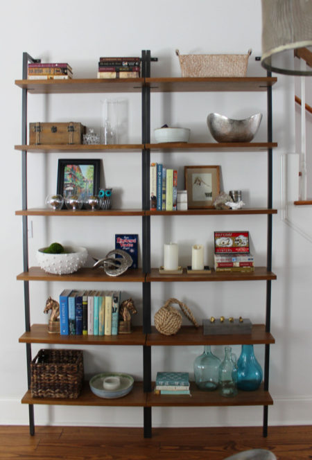 red and blue transitional living room | whitney j decor | new orleans homes | nola decor | red pillows | green walls | sherwin williams oyster gray on the walls | vintage red rug | pottery barn sectional | convertible coffee table | new orleans interior designer | new orleans decorator | new orleans blogger | nola interior designer | nola decorator | nola blogger