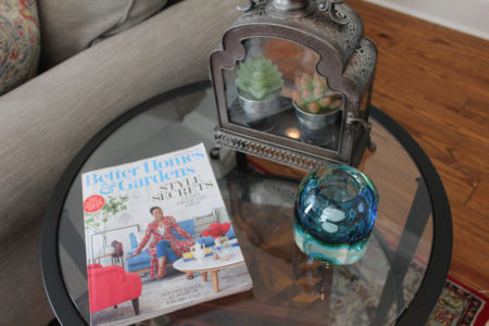 red and blue transitional living room | whitney j decor | new orleans homes | nola decor | red pillows | green walls | sherwin williams oyster gray on the walls | vintage red rug | pottery barn sectional | convertible coffee table | new orleans interior designer | new orleans decorator | new orleans blogger | nola interior designer | nola decorator | nola blogger