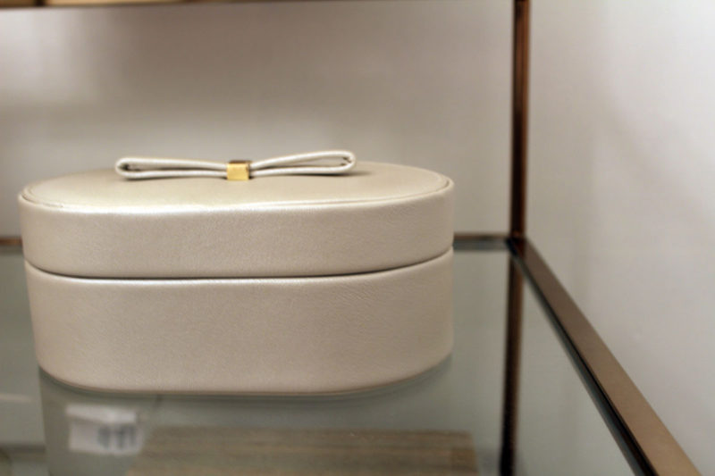 colorful guest bedroom with white walls | gold glass side table