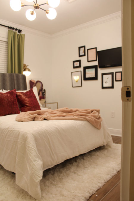 colorful guest bedroom with white walls