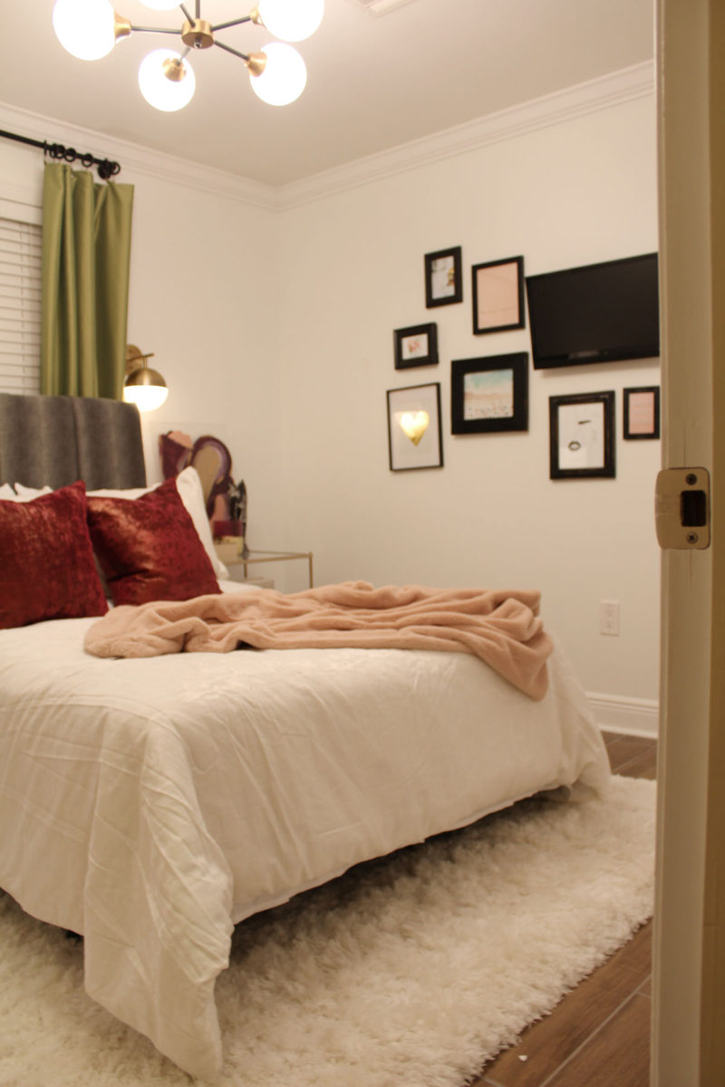 colorful guest bedroom with white walls