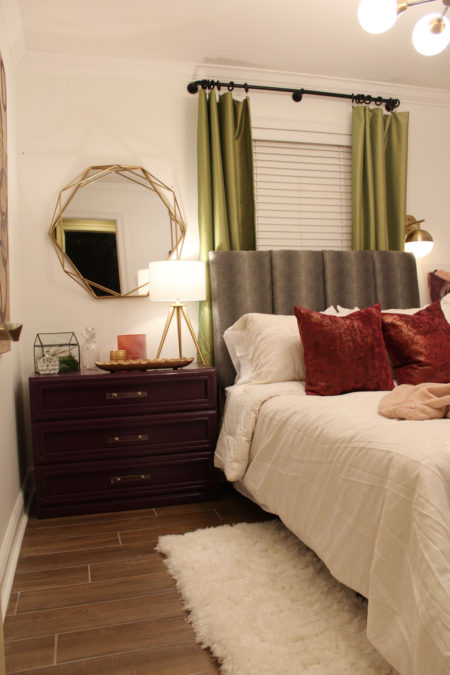 purple dresser and gold geometric mirror