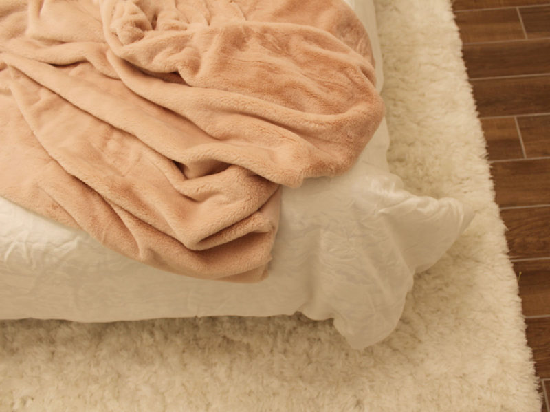 colorful guest bedroom with white walls