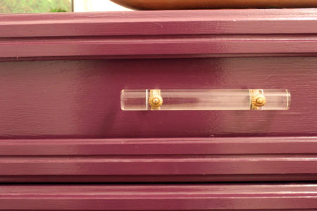 purple dresser and gold geometric mirror