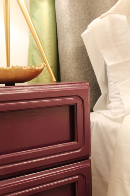 purple dresser and gold geometric mirror