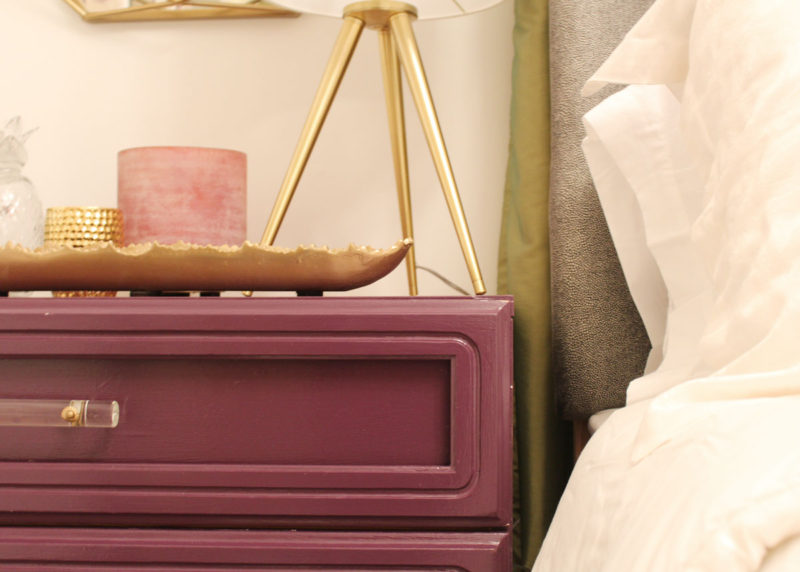 purple dresser and gold geometric mirror