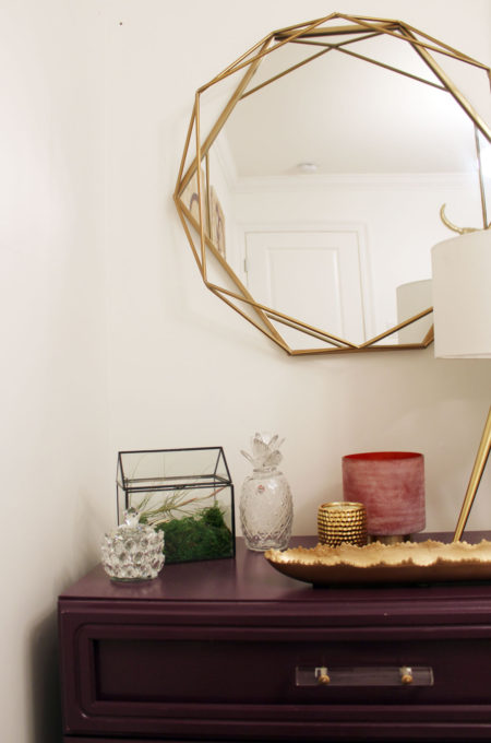 purple dresser and gold geometric mirror