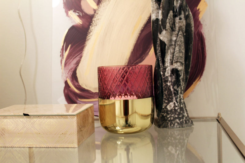 colorful guest bedroom with white walls | gold glass side table