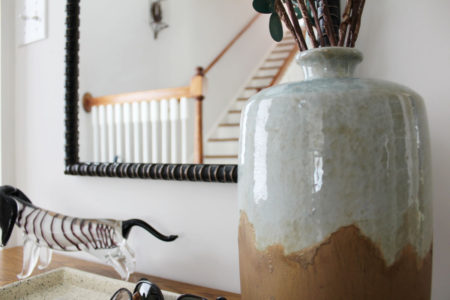 white transitional entryway with wallpaper