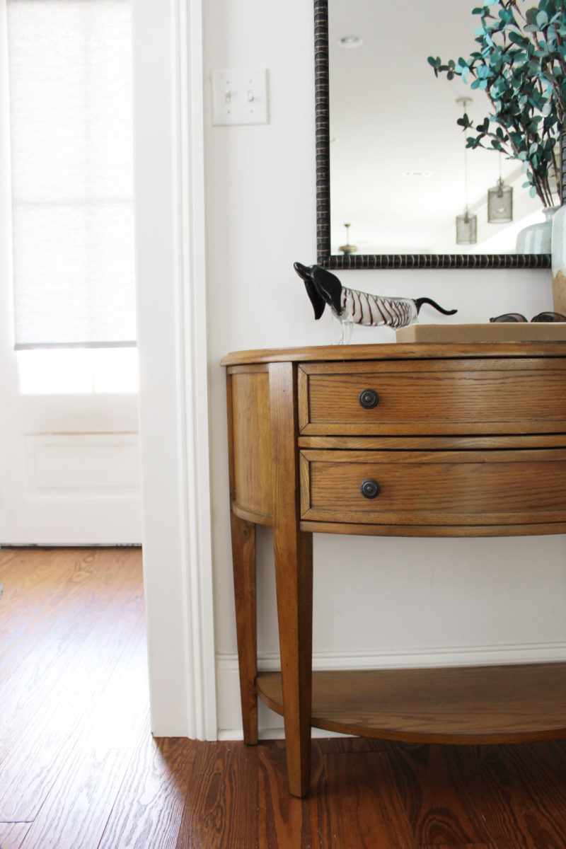 white transitional entryway with wallpaper