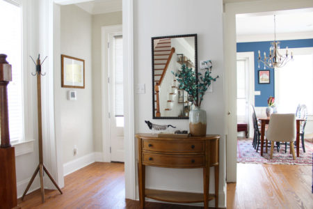 white transitional entryway with wallpaper