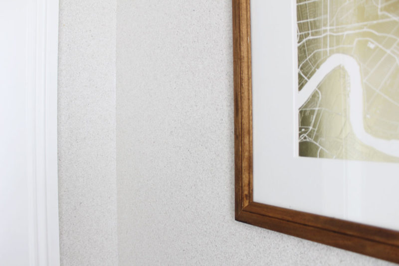 white transitional entryway with wallpaper