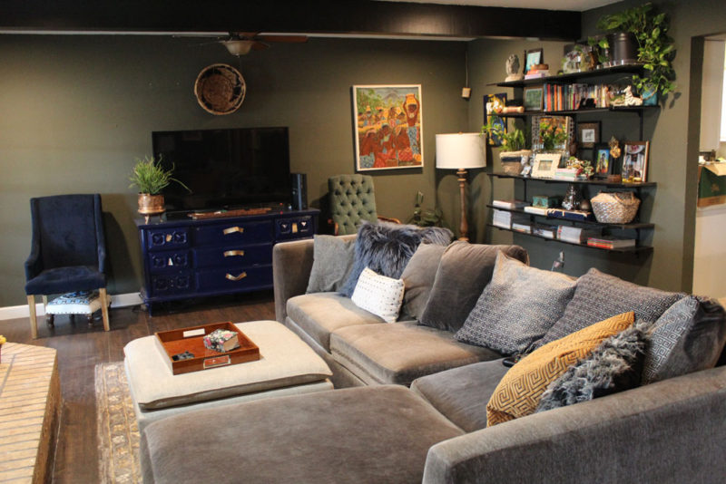 whitney j decor | my living room progress | green walls in dining room | green living room | wall shelving | track shelving