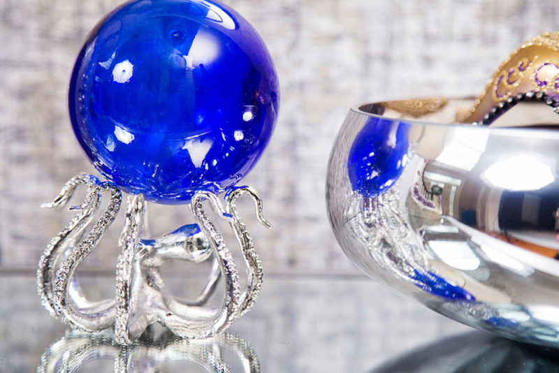 gray and purple entryway with blue and silver accessories