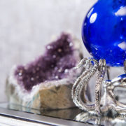 gray and purple entryway with blue and silver accessories