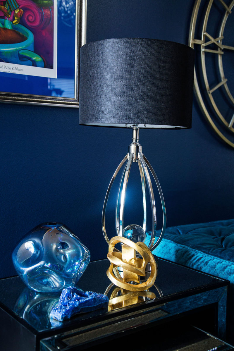 blue walls and silver lamp
