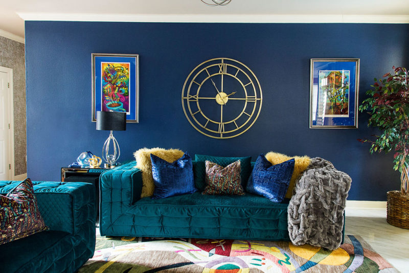 blue walls and green sofa