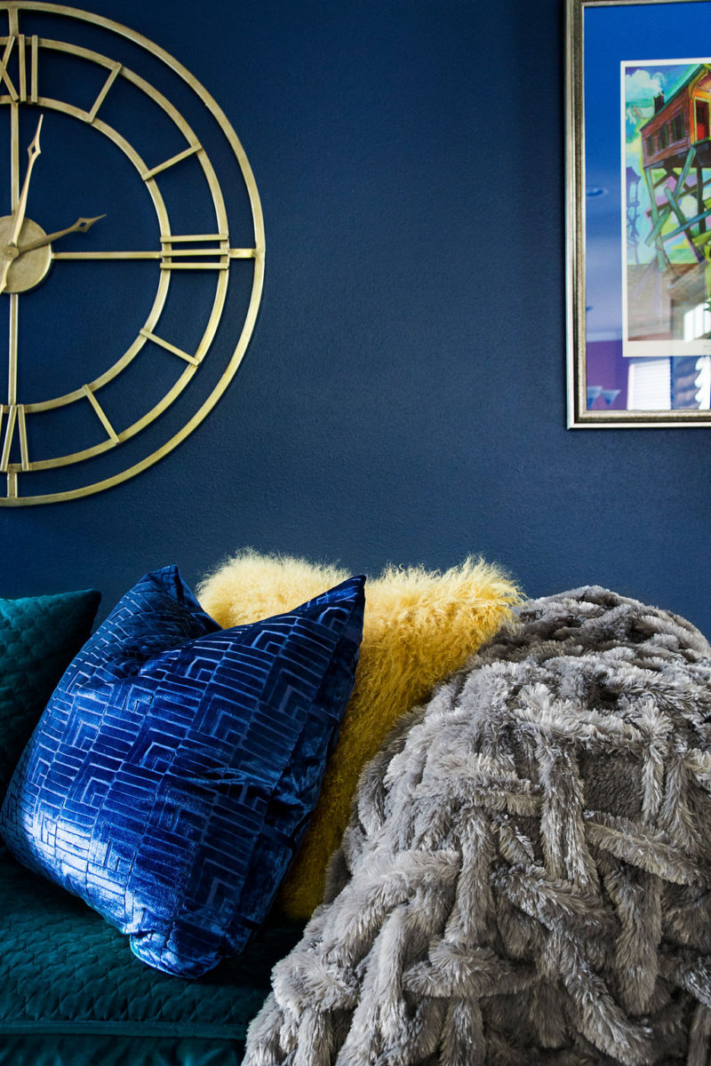 blue walls with colorful pillows