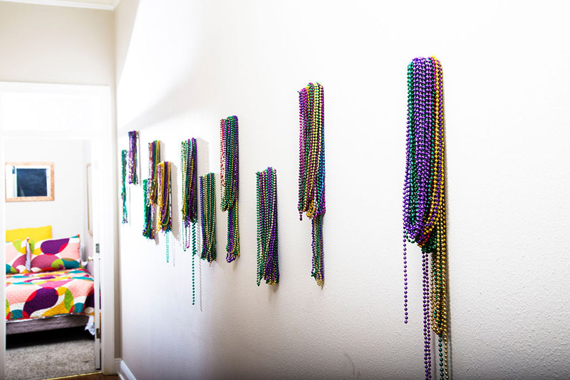 mardi gras beads on wall