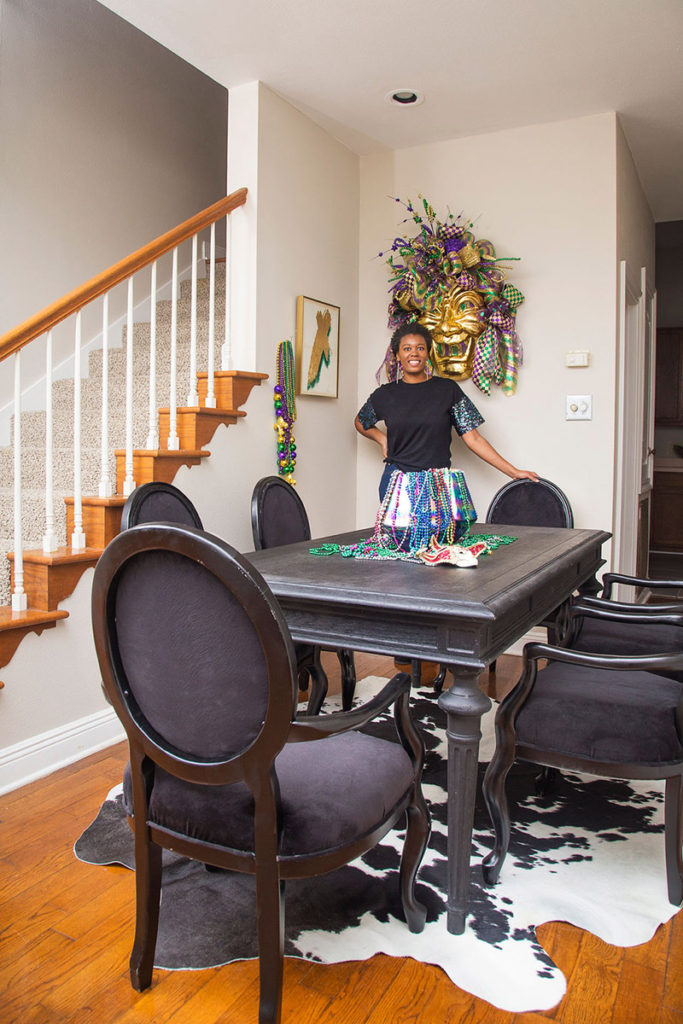 whitney jones in mardi gras decorated dining room