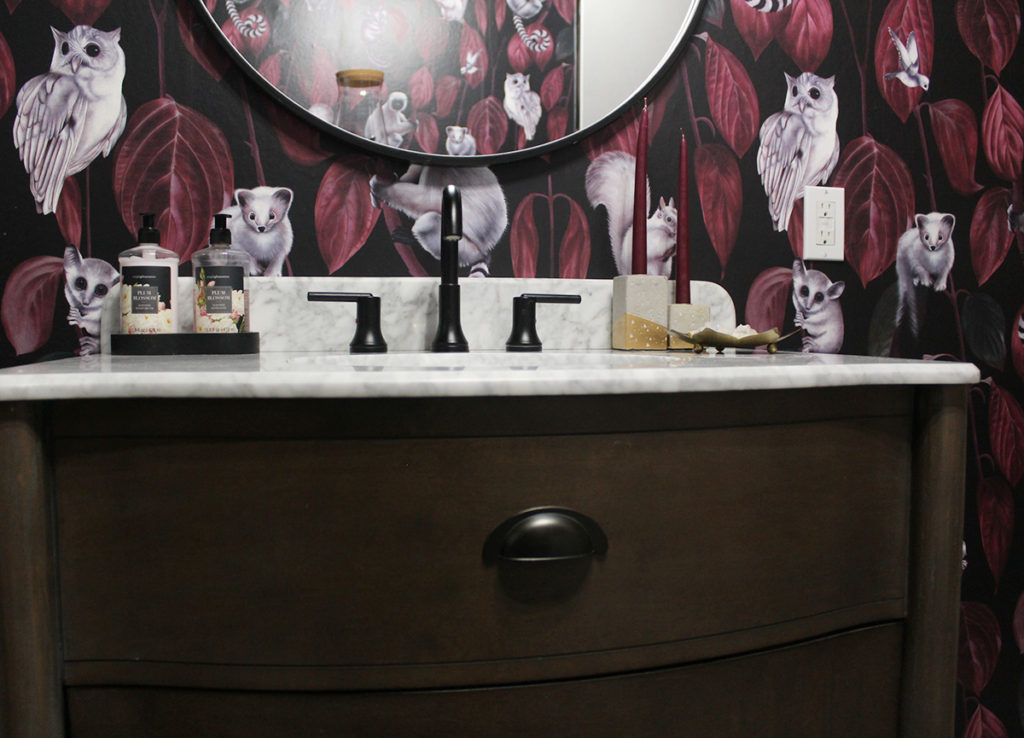 bold wallpaper and brown vanity