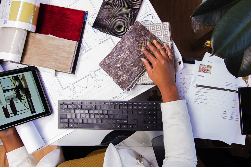 flatlay of Whitney J Decor with design presentation of fabric samples and construction documents