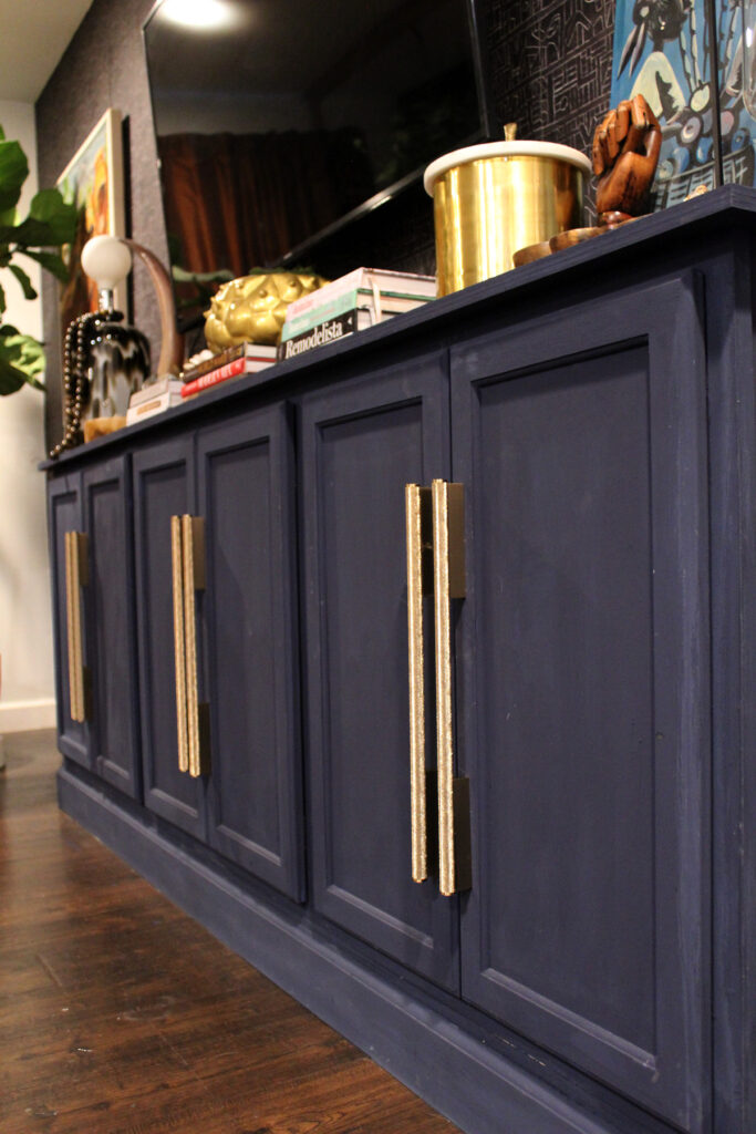 moody living room with blue diy media console