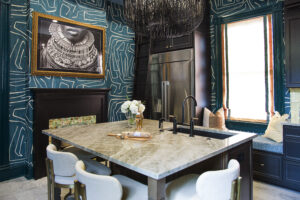 Bold blue kitchen with warm wood accents, brass hardware, and layered styling by Whitney J Decor.